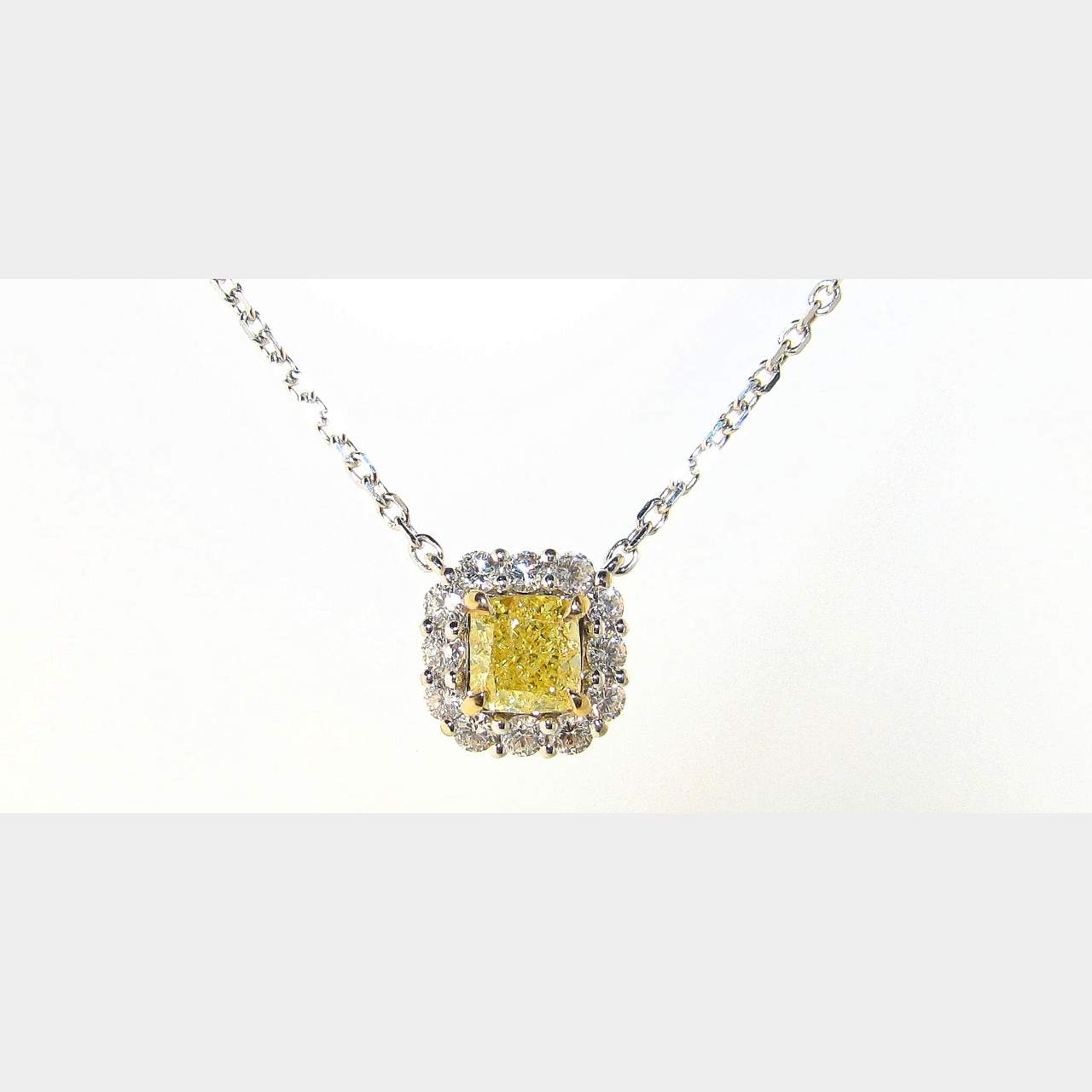 1.01 CT. Natural Fancy Yellow Cushion Shape Diamond 18K Two Tone Gold Diamond Pendant.